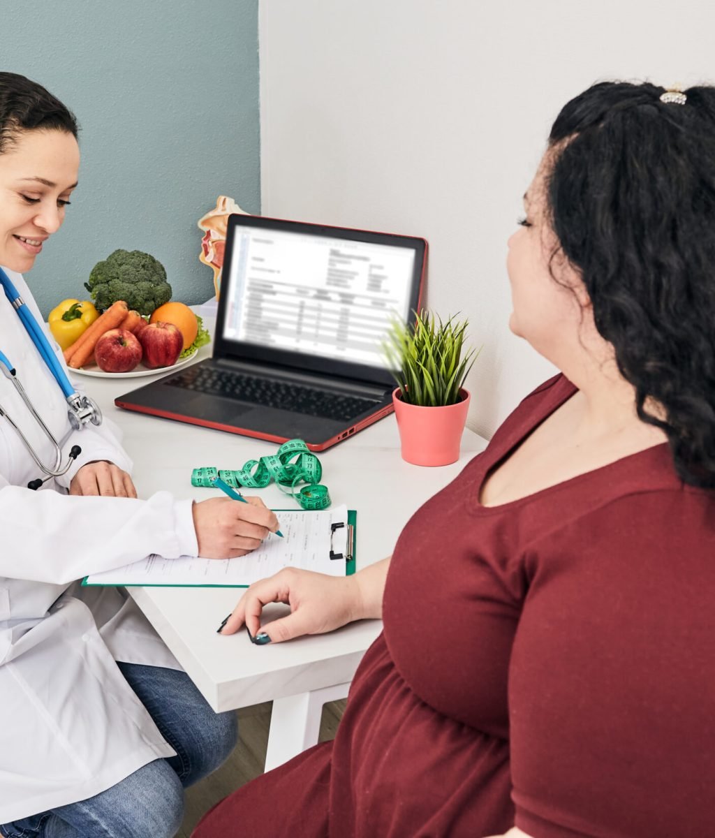 Obesity, unhealthy weight. Nutritionist calculating body mass index of fat woman for obesity treatment